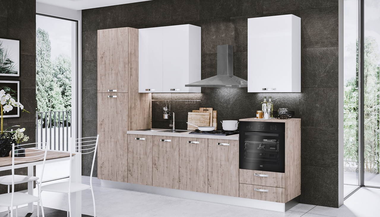 Cucina di design con piano cottura a gas, cappa a muro e forno elettrico nella sezione dedicata ai consigli per acquisti consapevoli.